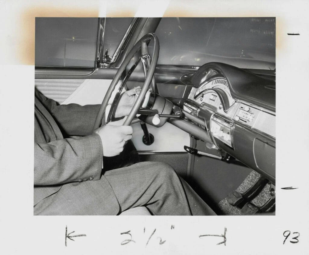 engineer checking the controls and driver’s seating position in the 1950s