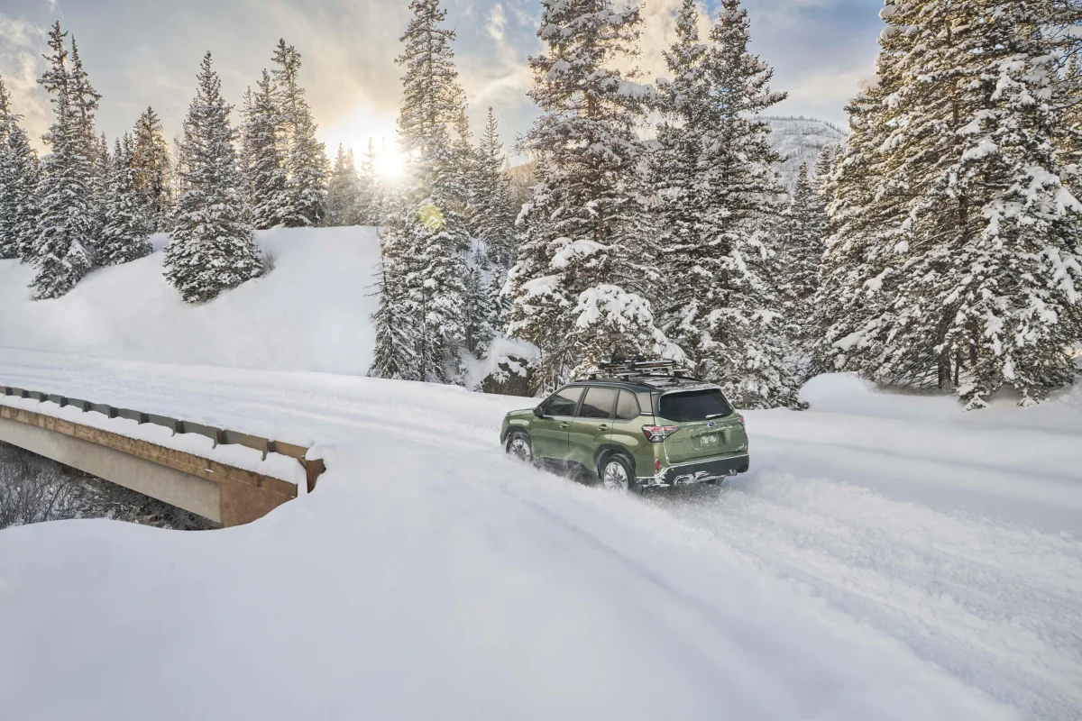 2025 Subaru Forester Hybrid exterior rear three quarter in snow